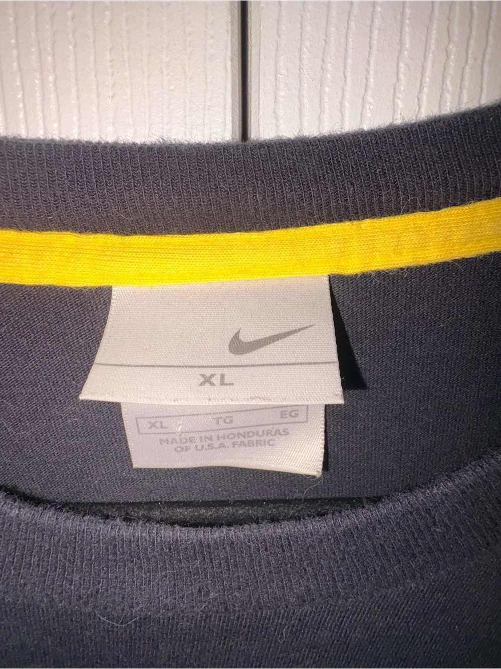 Nike Black Long-Sleeve Tee with Yellow Logo and Sleeve Text